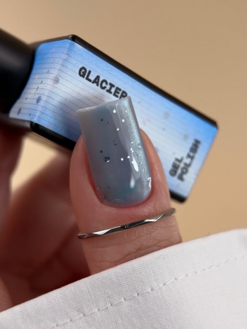 BIBLIOTEKA Cat Eye Gel Polish 24 Glacier, 10 ml - niebieski lakier hybrydowy z efektem „kociego oka"